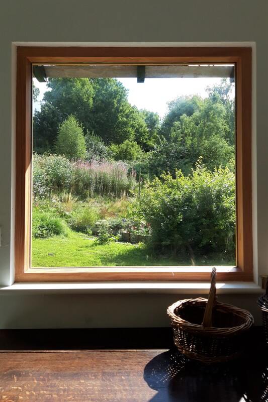 Large window in sustainable garden cabin