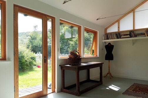 Sunlight streams into bespoke garden office studio built with sustainable, natural materials