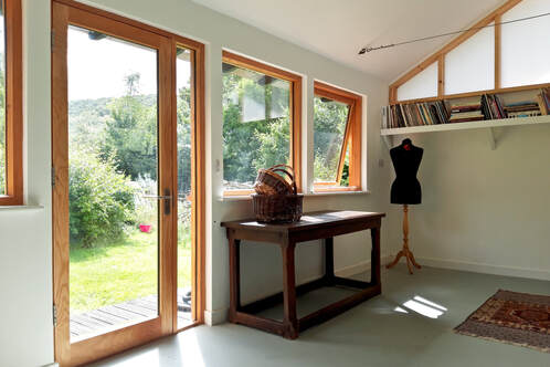 Interior of an artists studio cabin built by Origin Natural Building in mid Wales